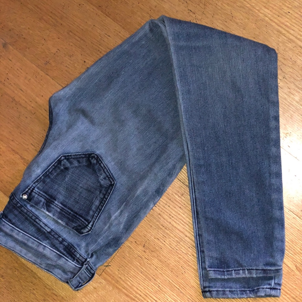 Bebe mid-wash distressed skinny jeans